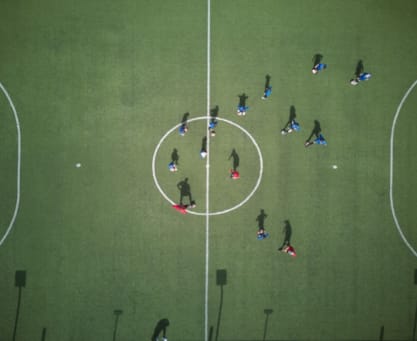 a group of people playing football