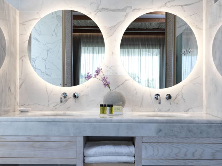 a white bathtub with a flower in it