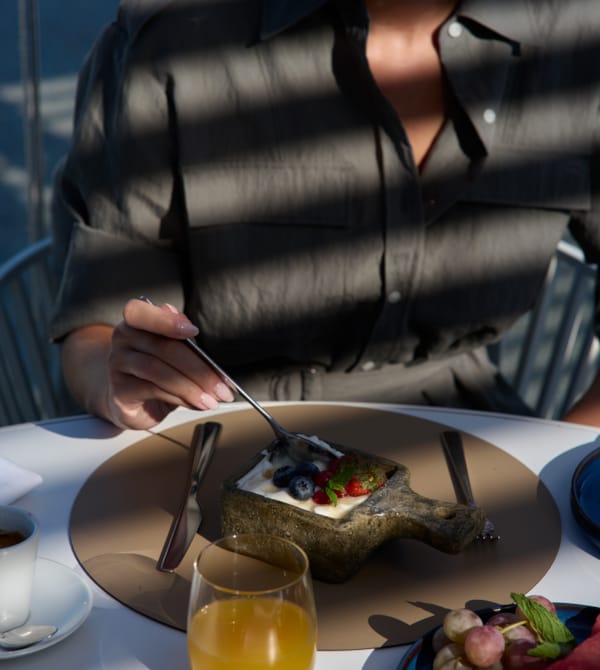 a woman eating a dessert
