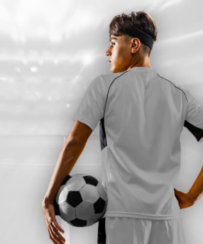 a man holding a football ball