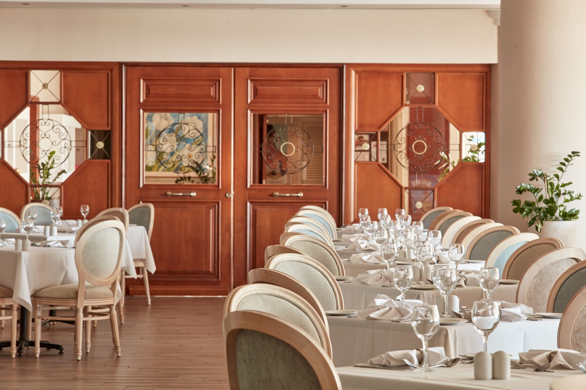 a room with a couch and chairs