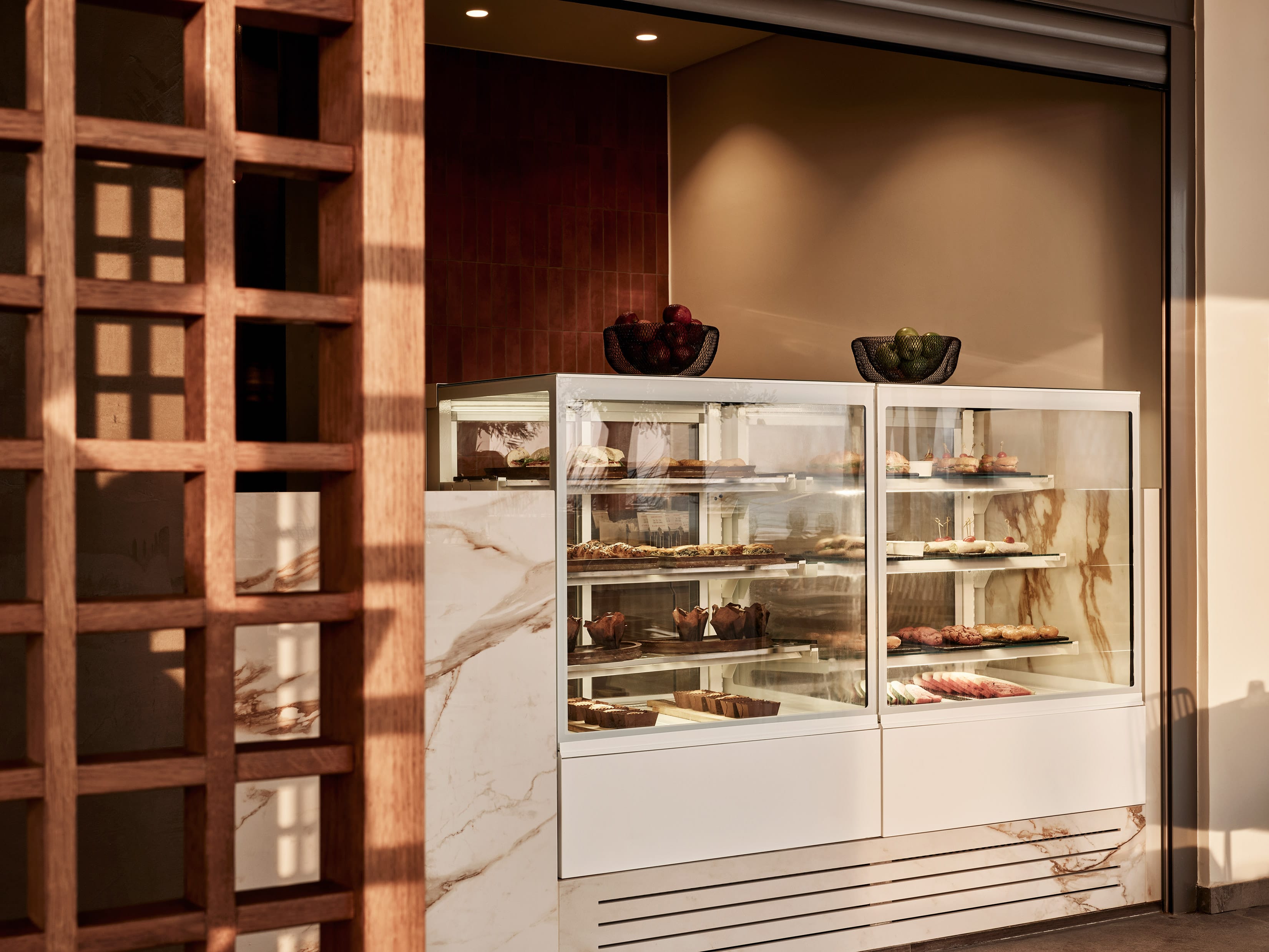 a glass display case with food