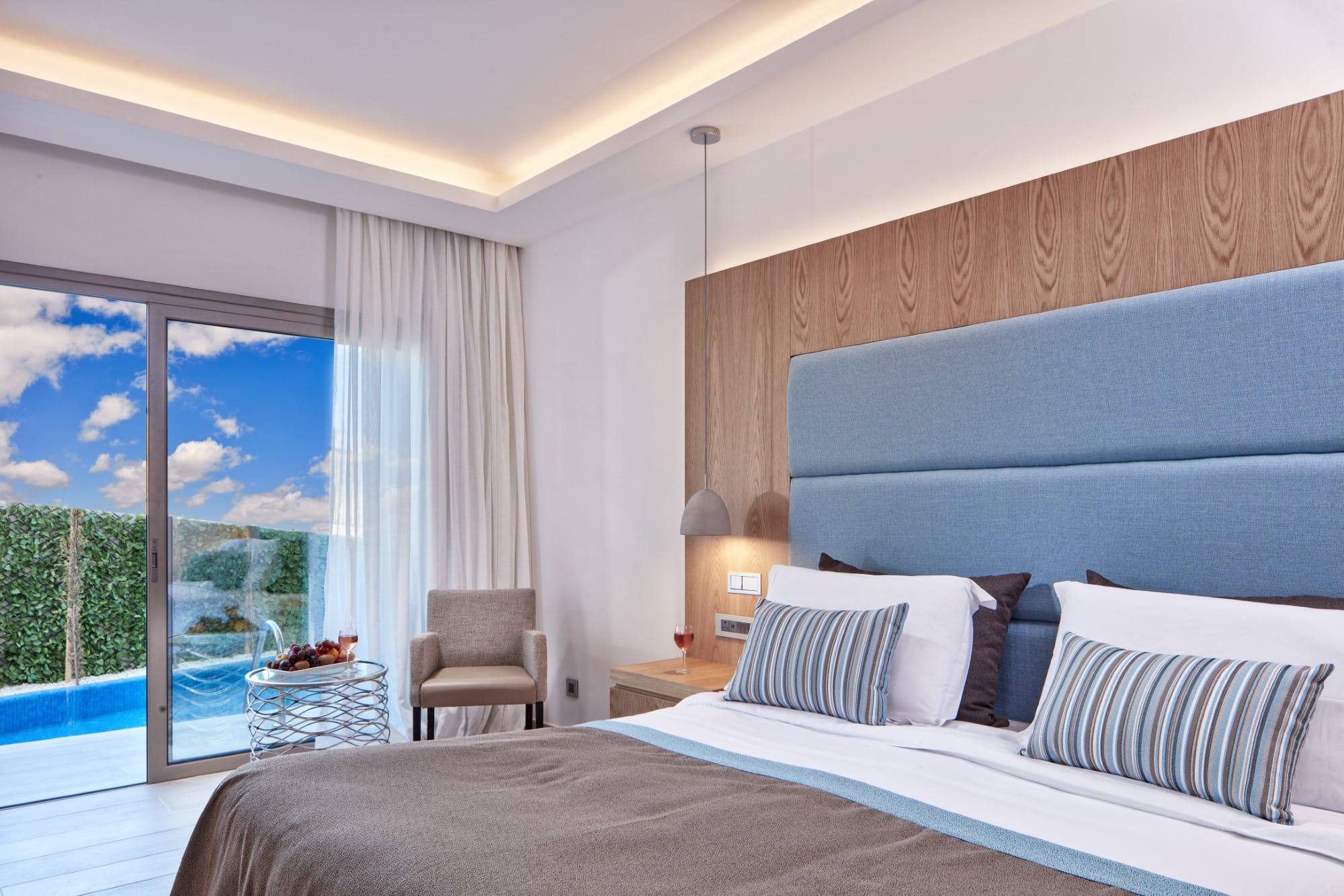 a bedroom with a large window