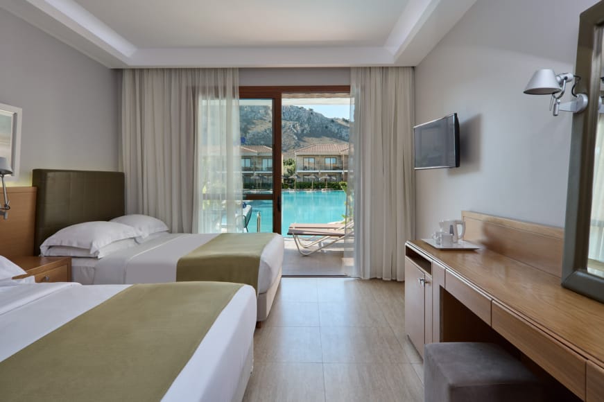 a hotel room with a large balcony