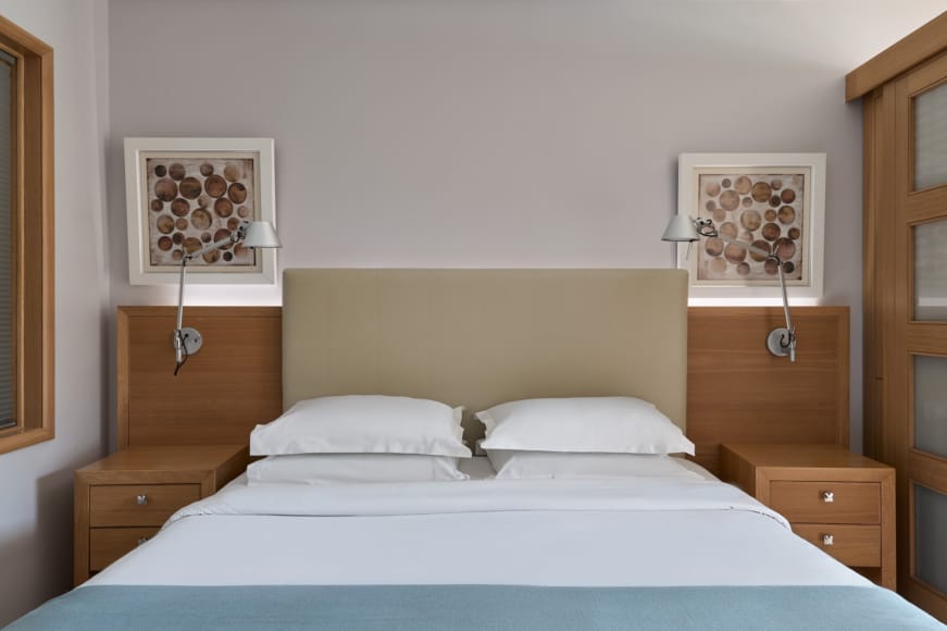 a bed with a blue cover