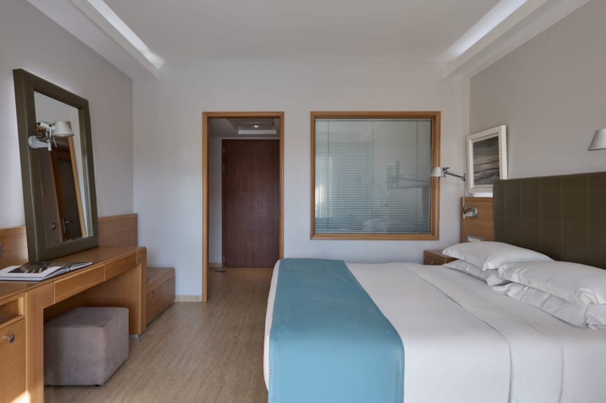 a hotel room with two beds