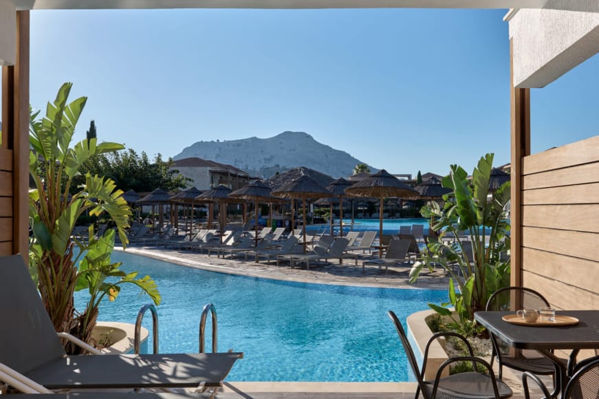 a pool with a mountain in the background