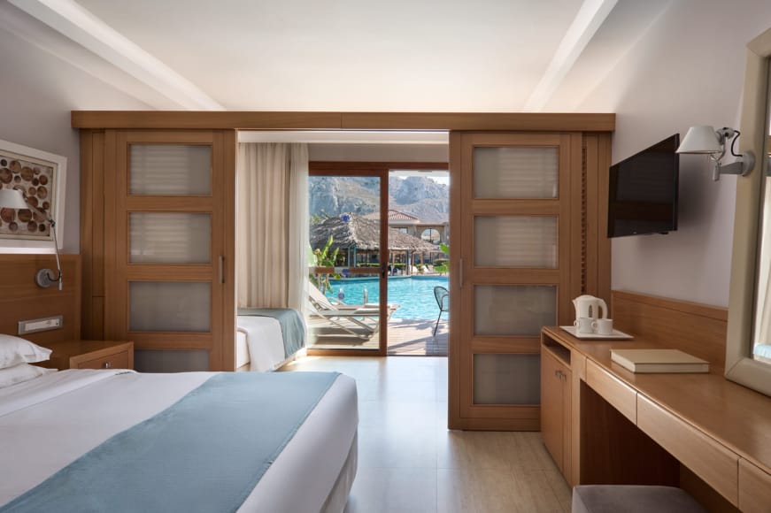 a bedroom with a large glass door