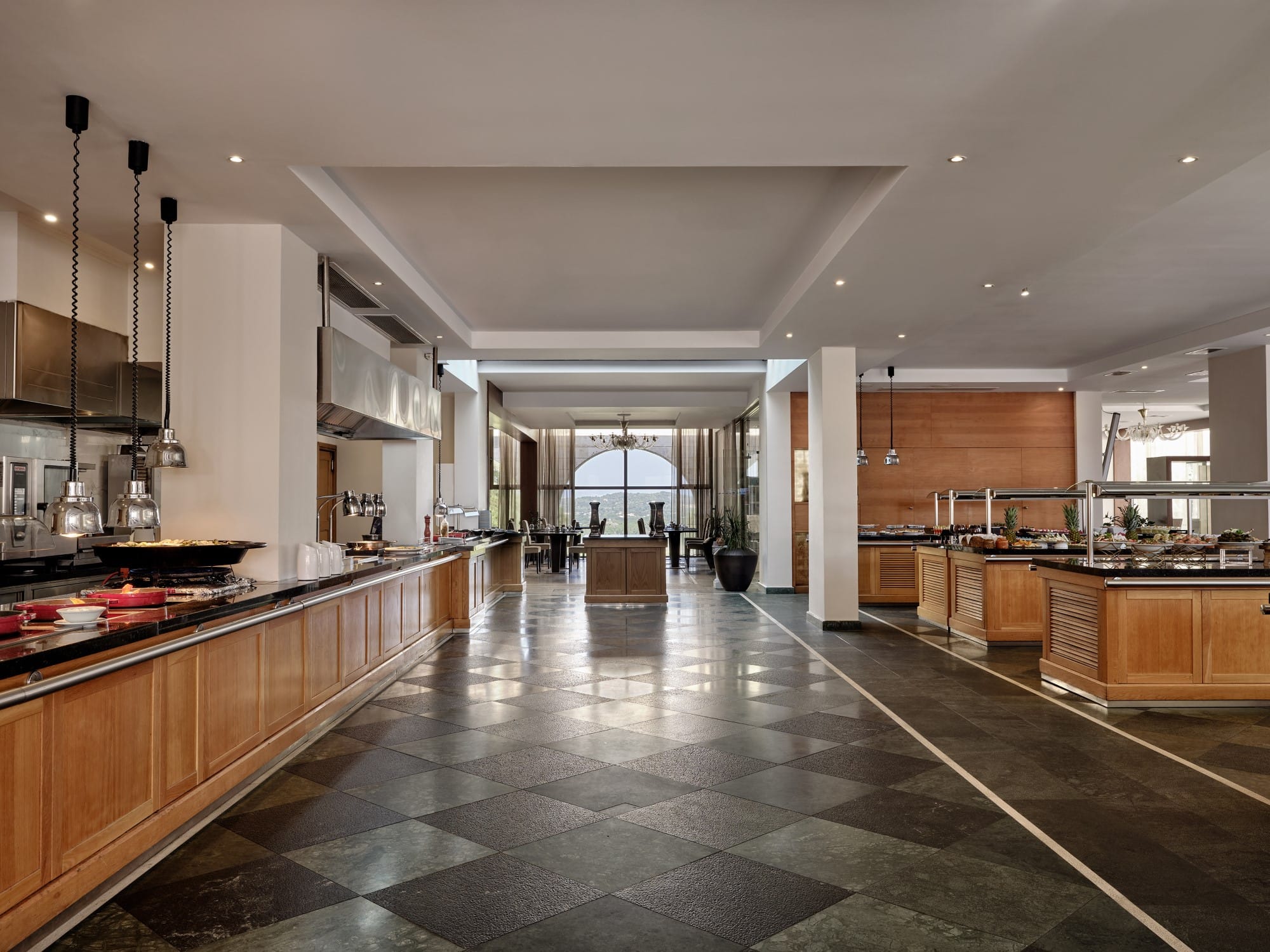 a large kitchen with marble counters
