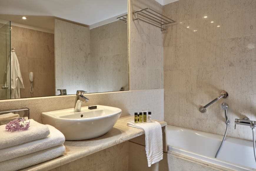 a bathroom with a tub sink and a bathtub