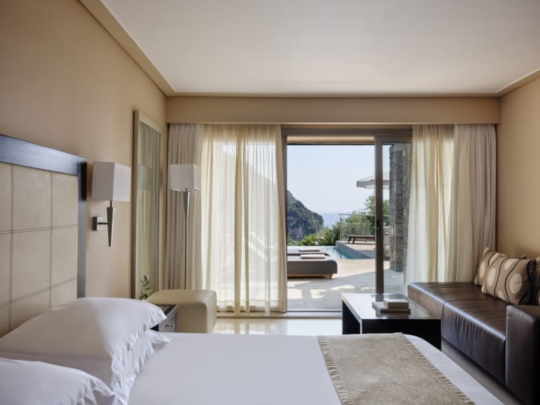 a bedroom with a large window