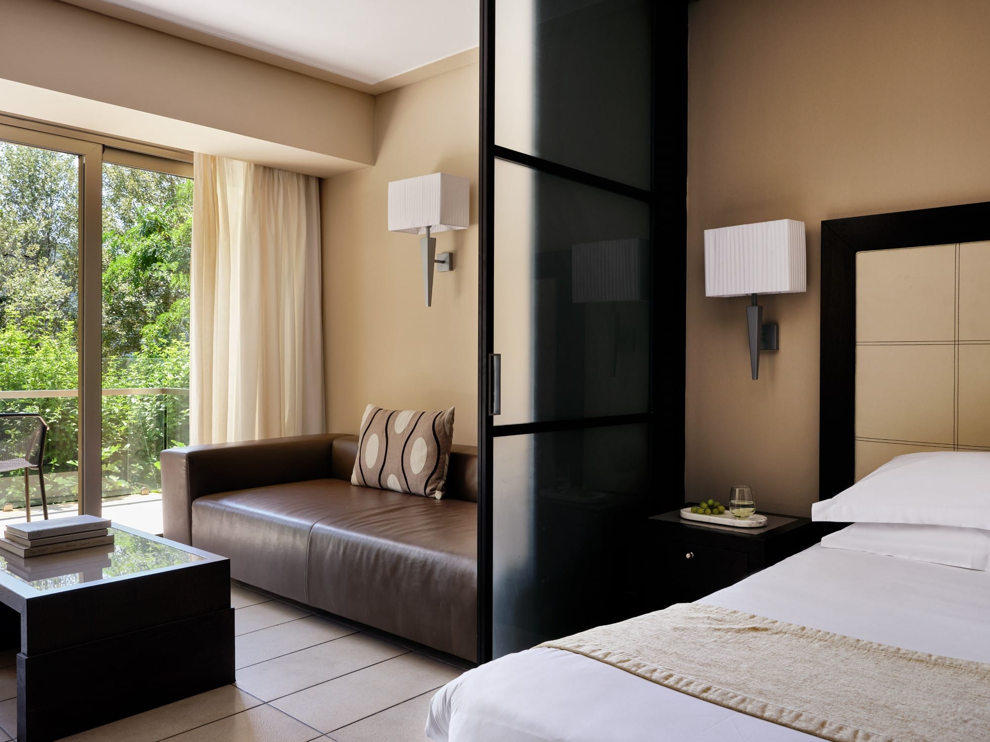 a bedroom with a bed and a refrigerator