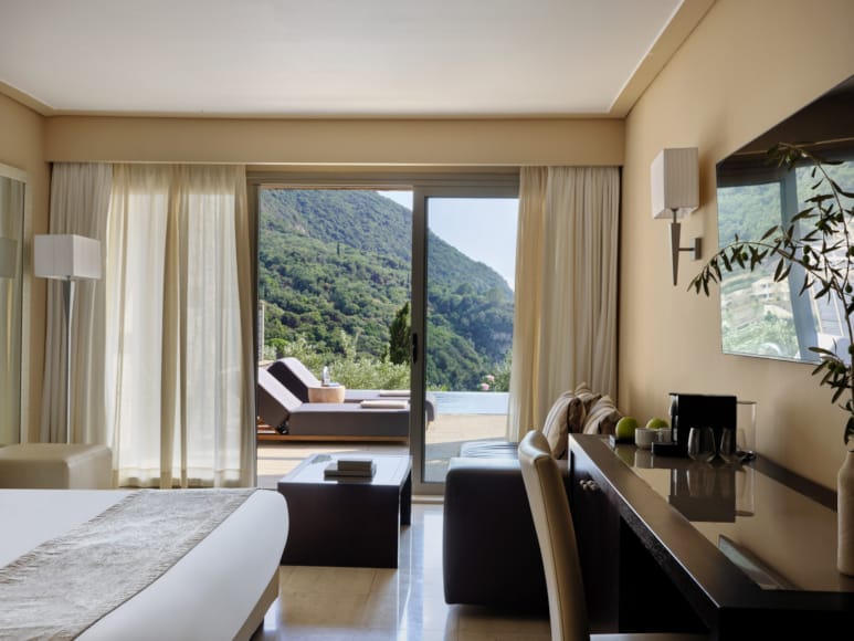 a room with a bed desk and a window