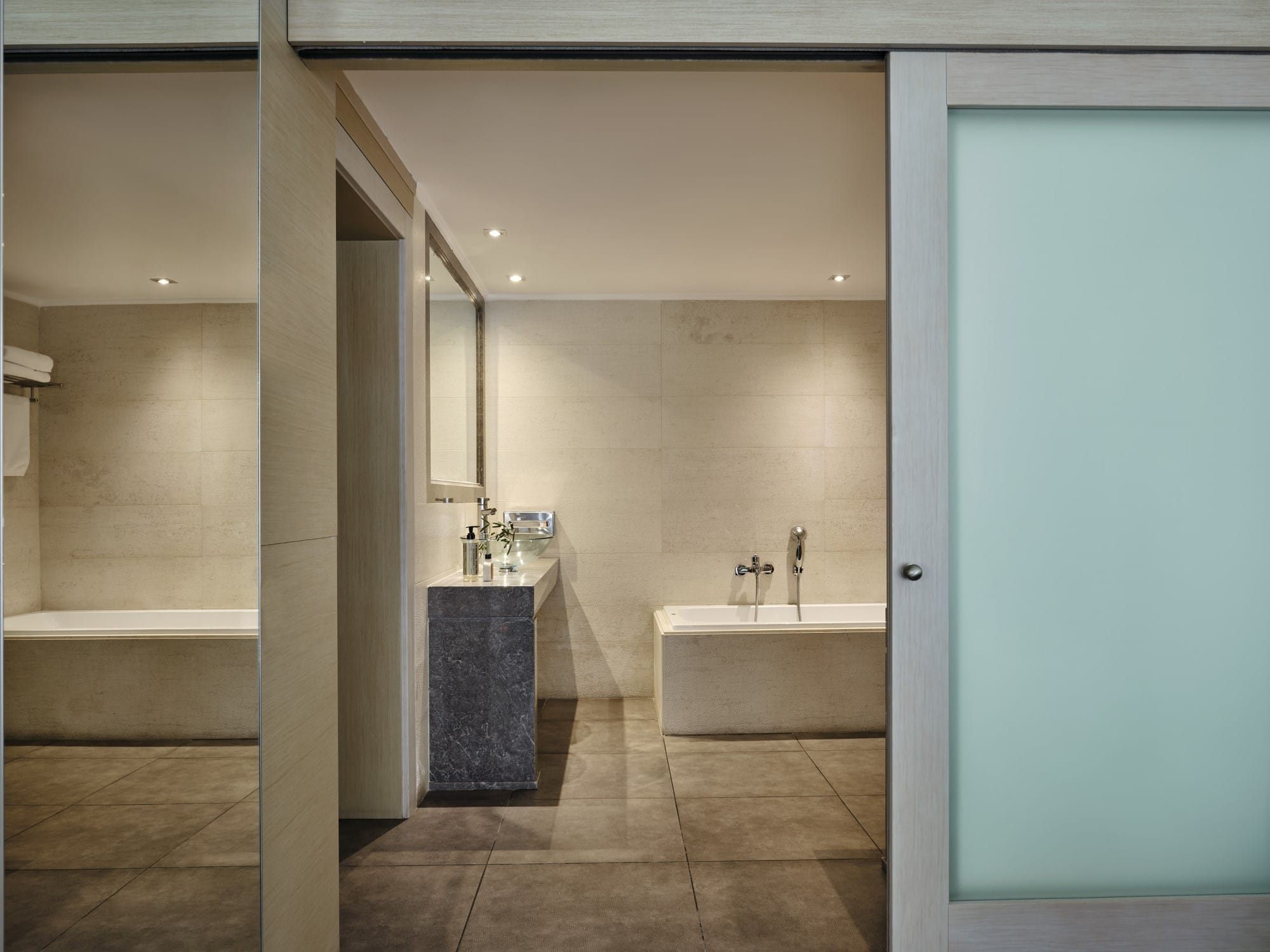 a bathroom with a tub and sink