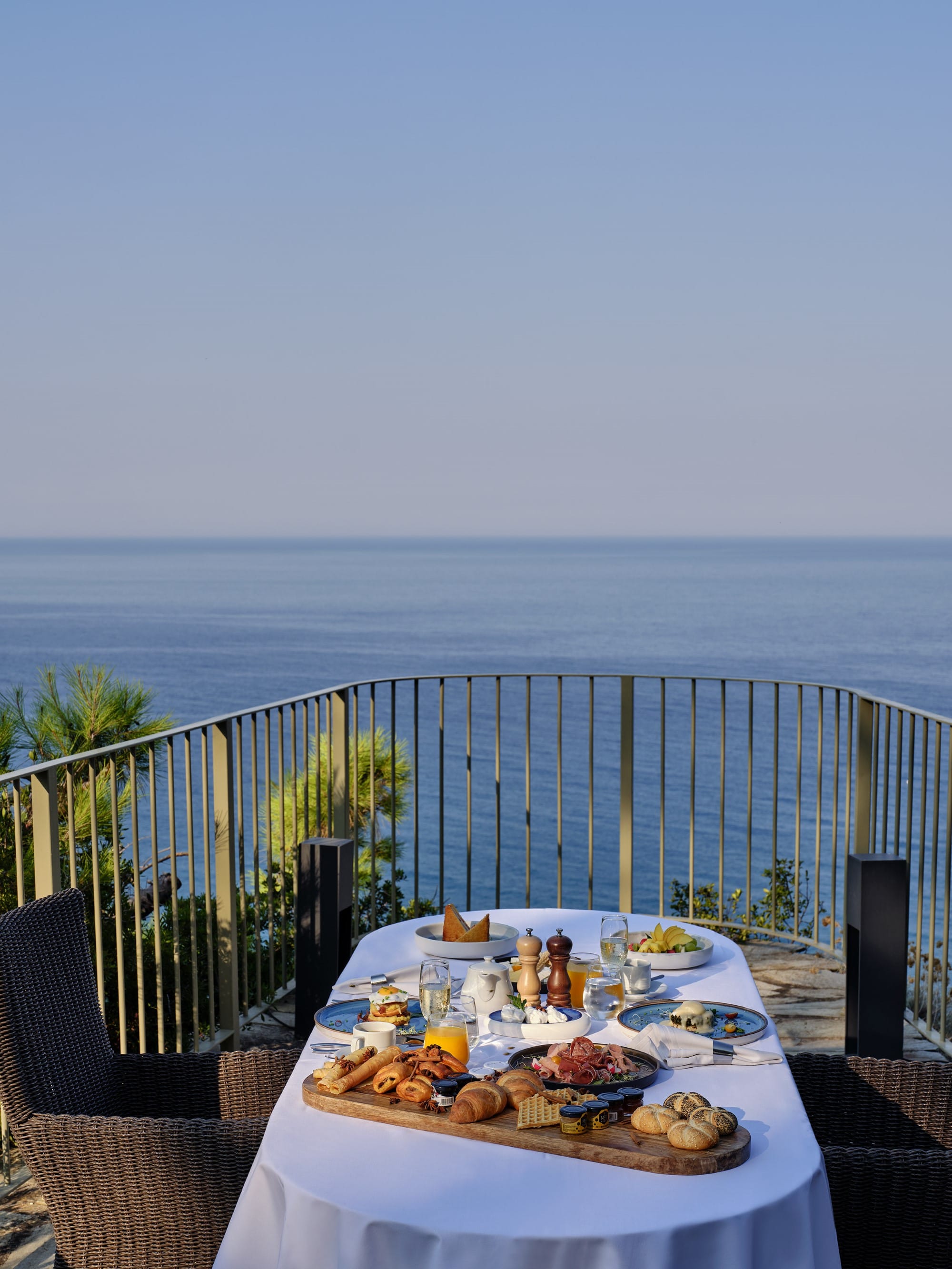 a table with food on it by a body of water