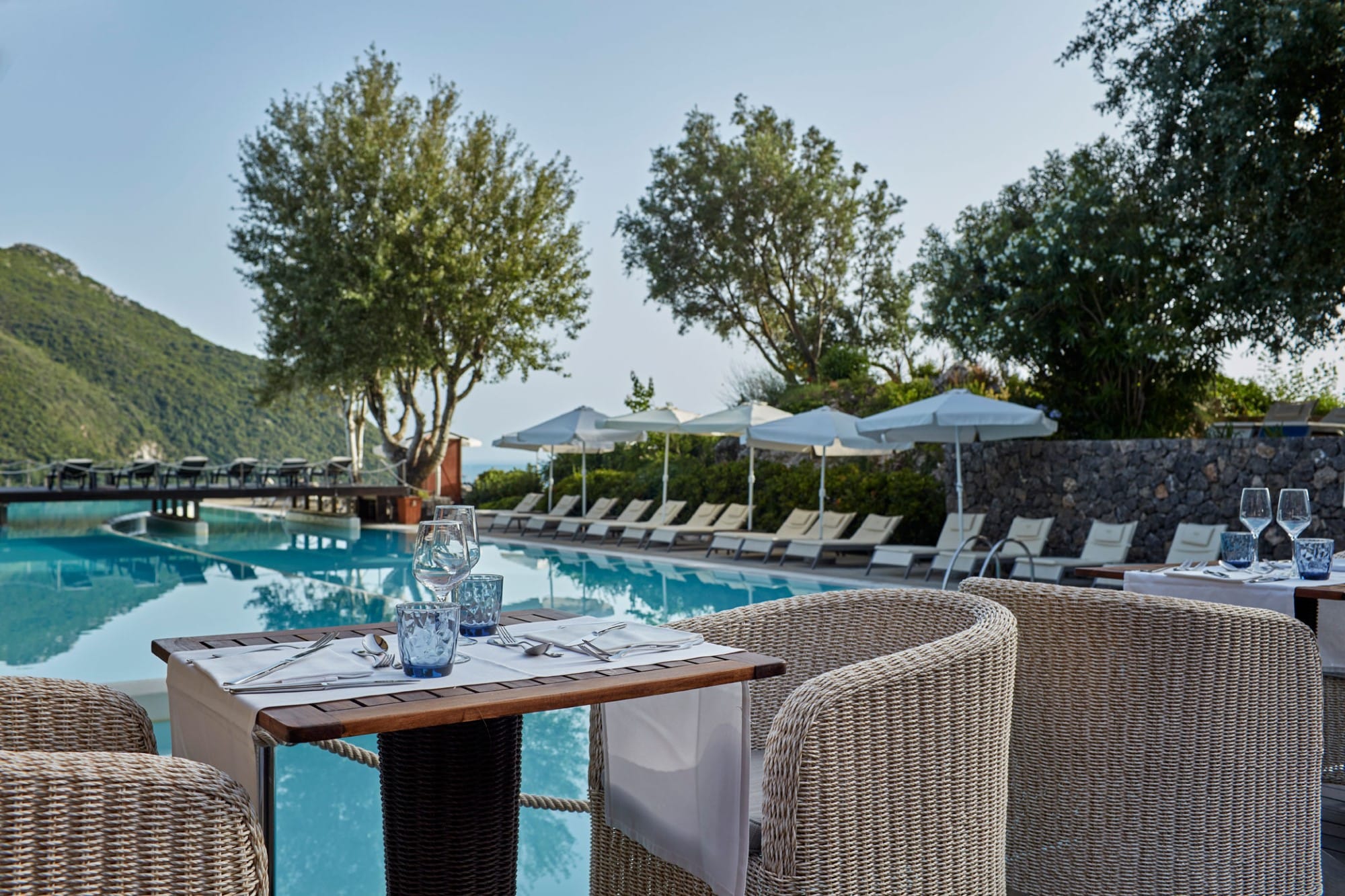 a pool with chairs around it