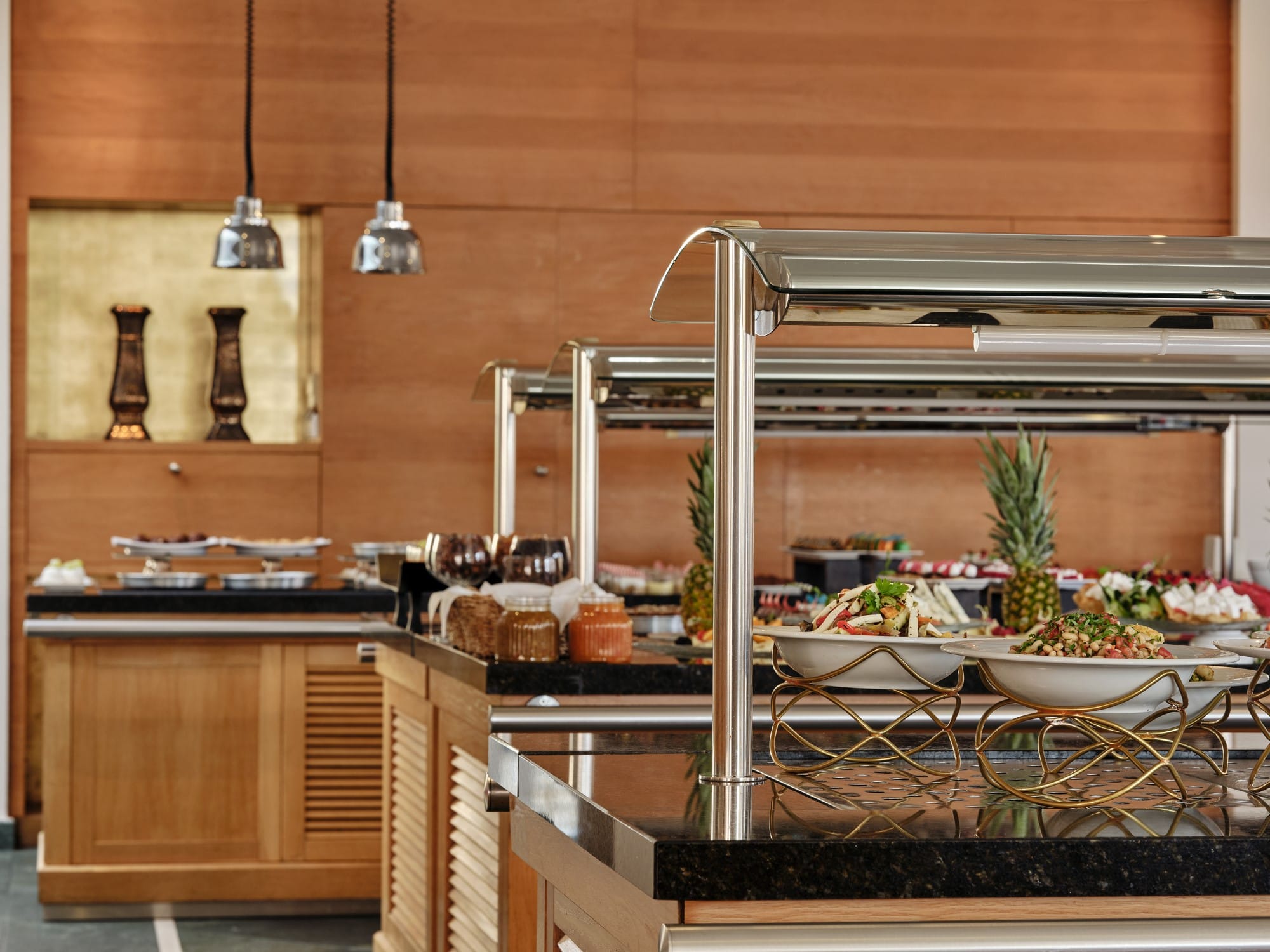 a kitchen with a large metal bar