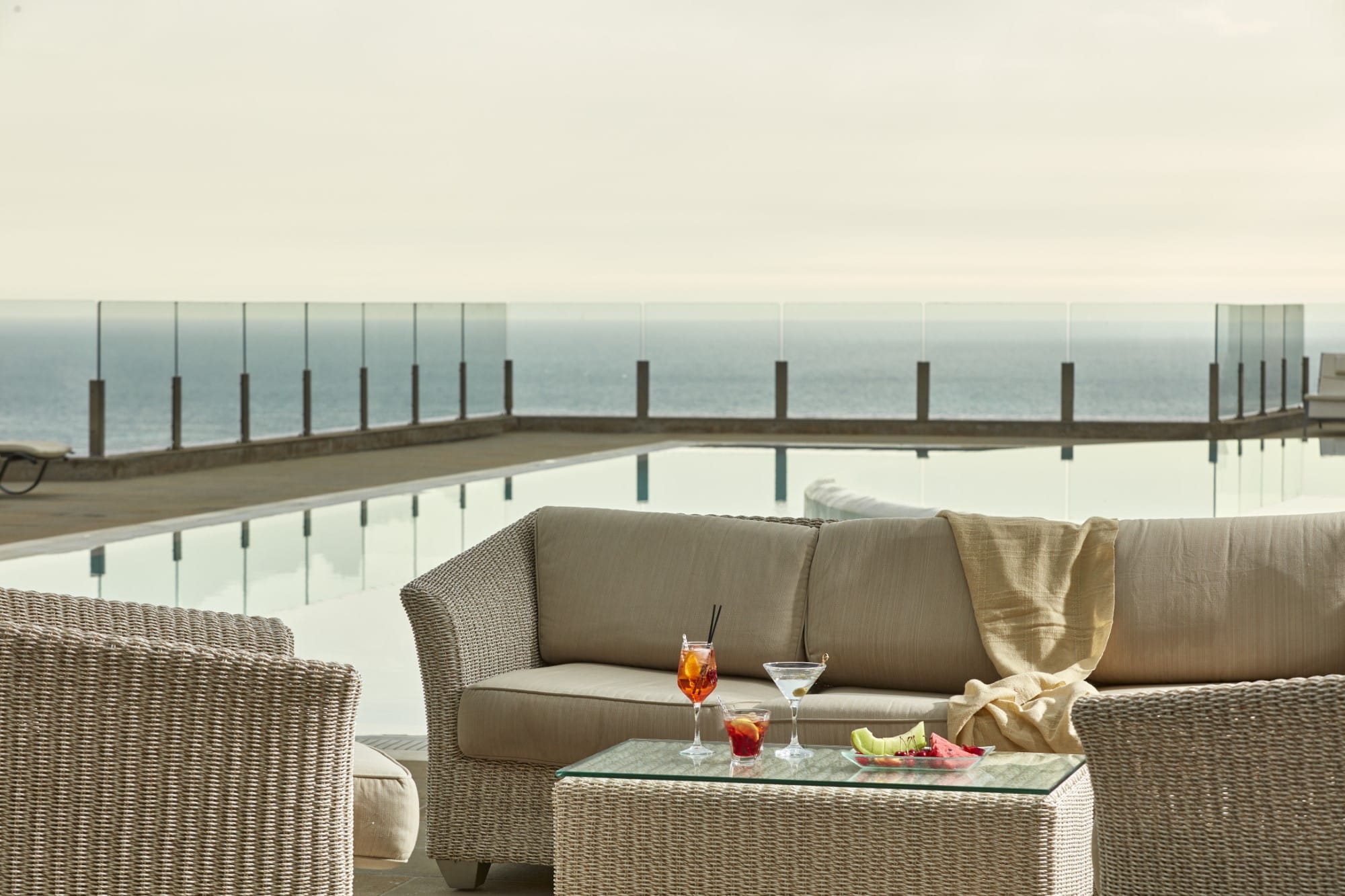 a couch and table on a deck