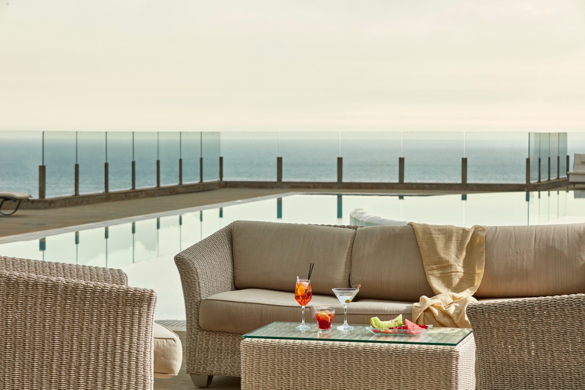 a couch and table on a deck