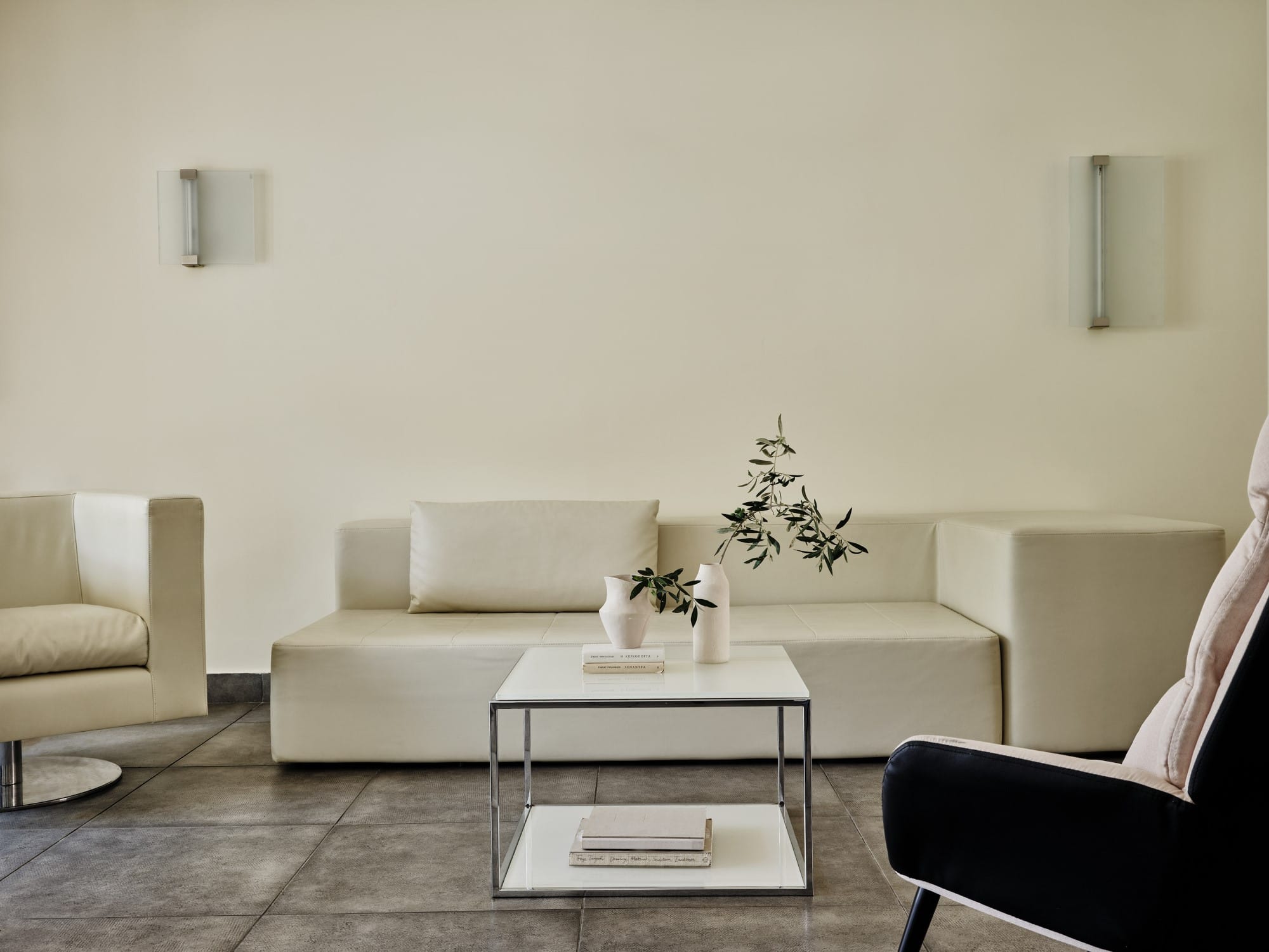 a living room with white couches