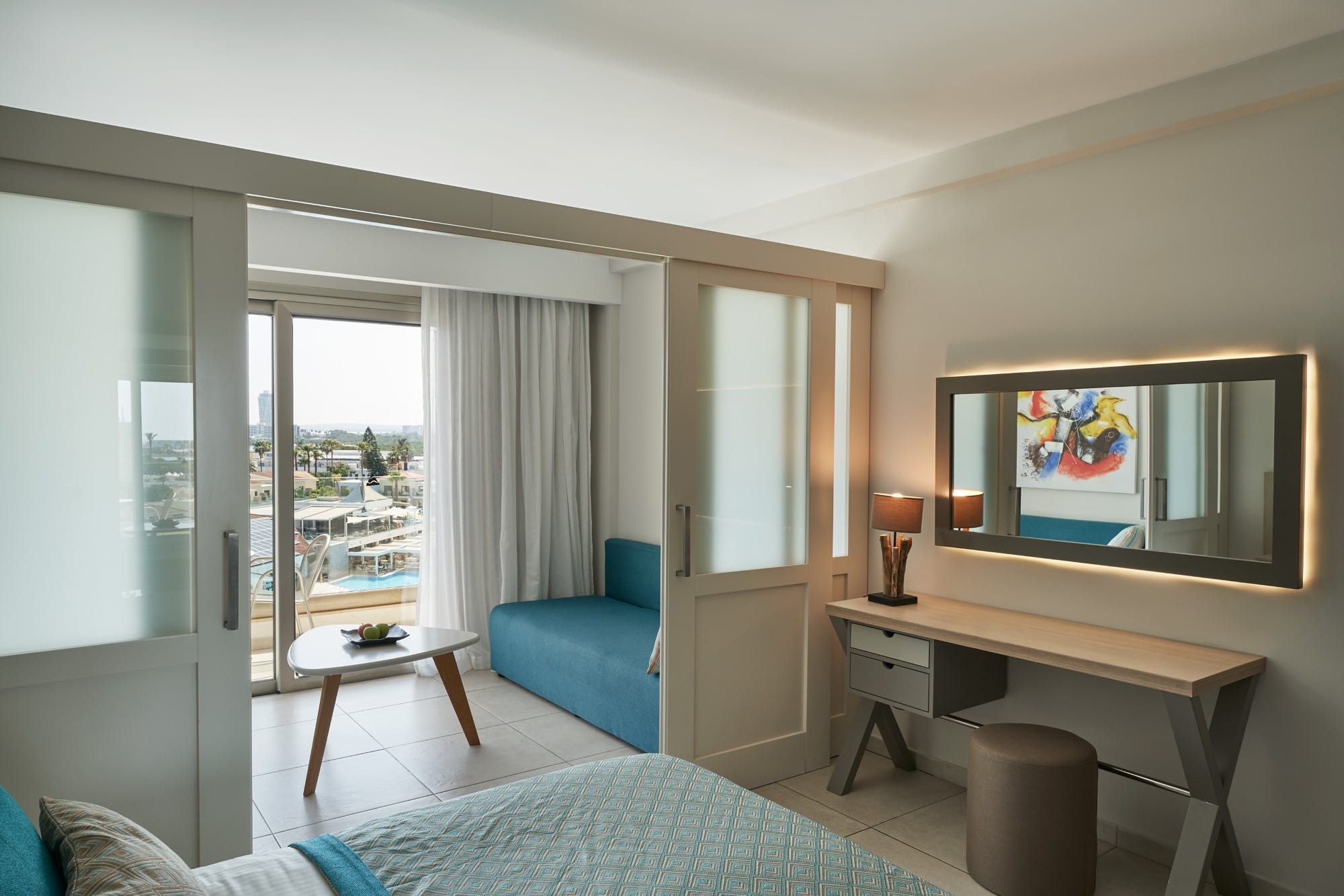 a room with a bed and a desk