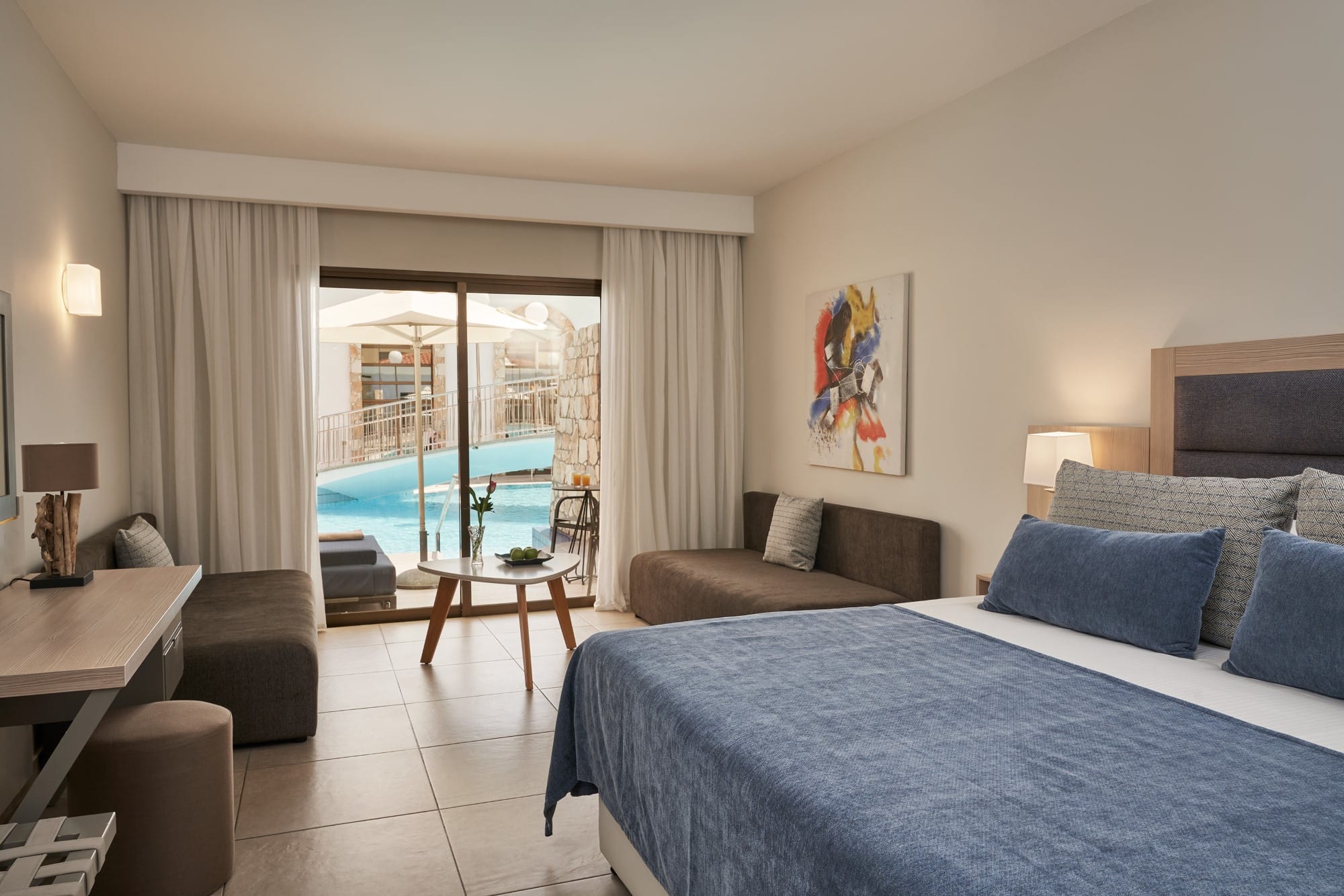 a bedroom with a large window