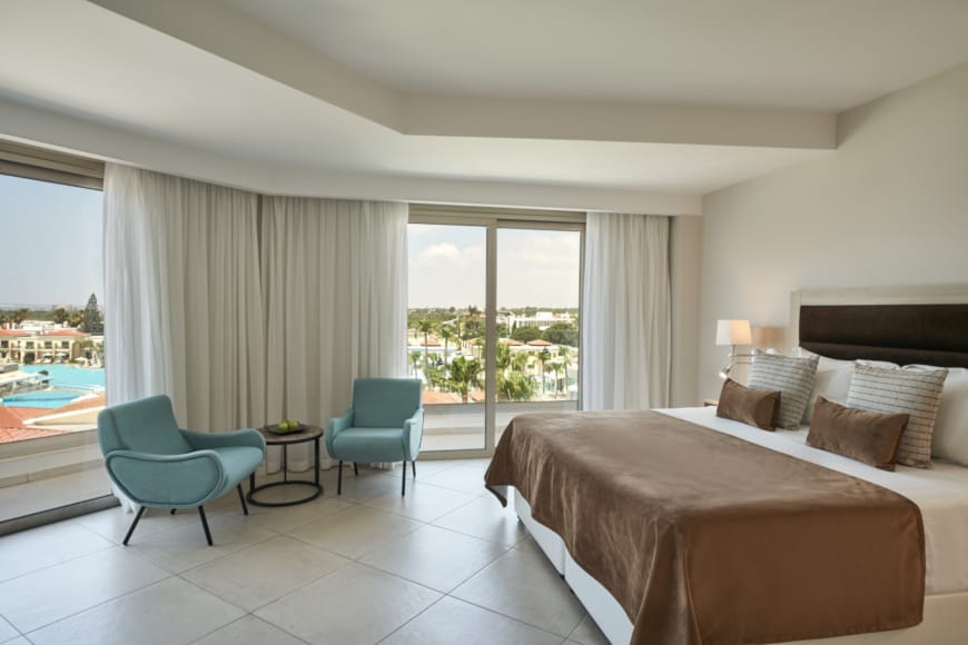 a bedroom with a large window