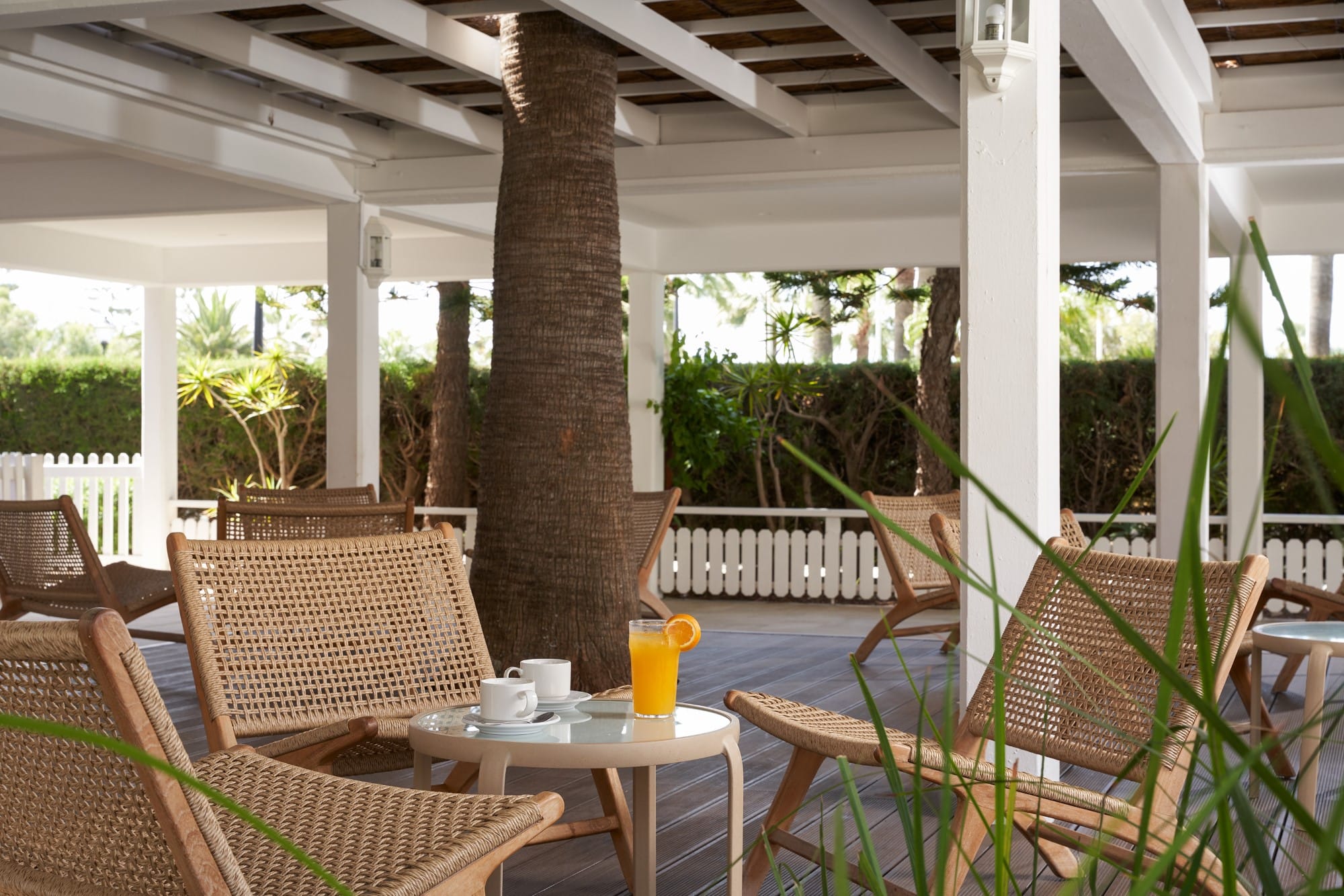 a table and chairs under a covered area