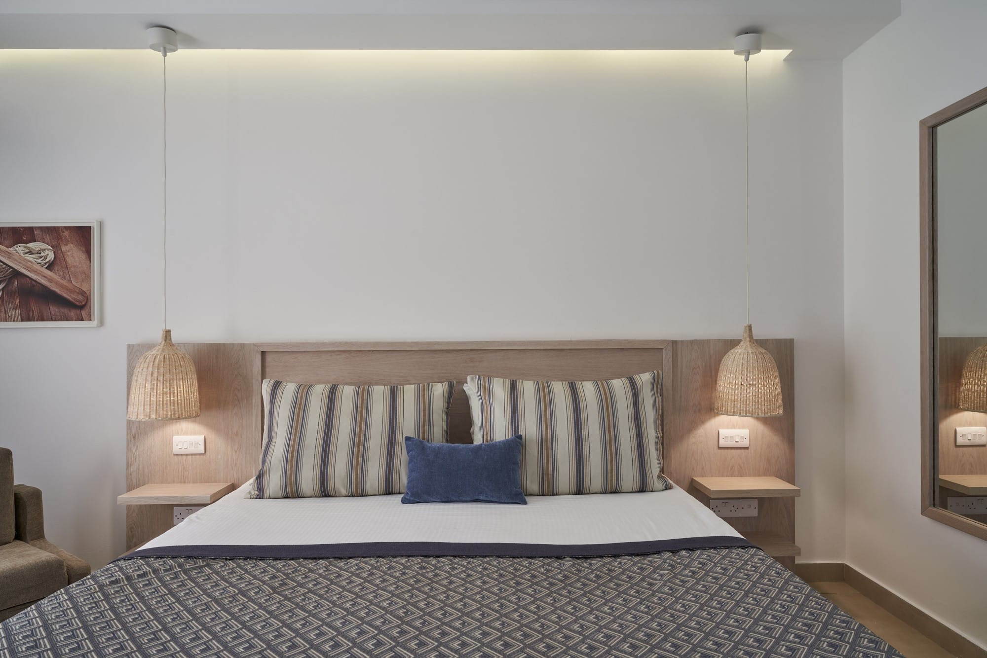 a bed with a white wall