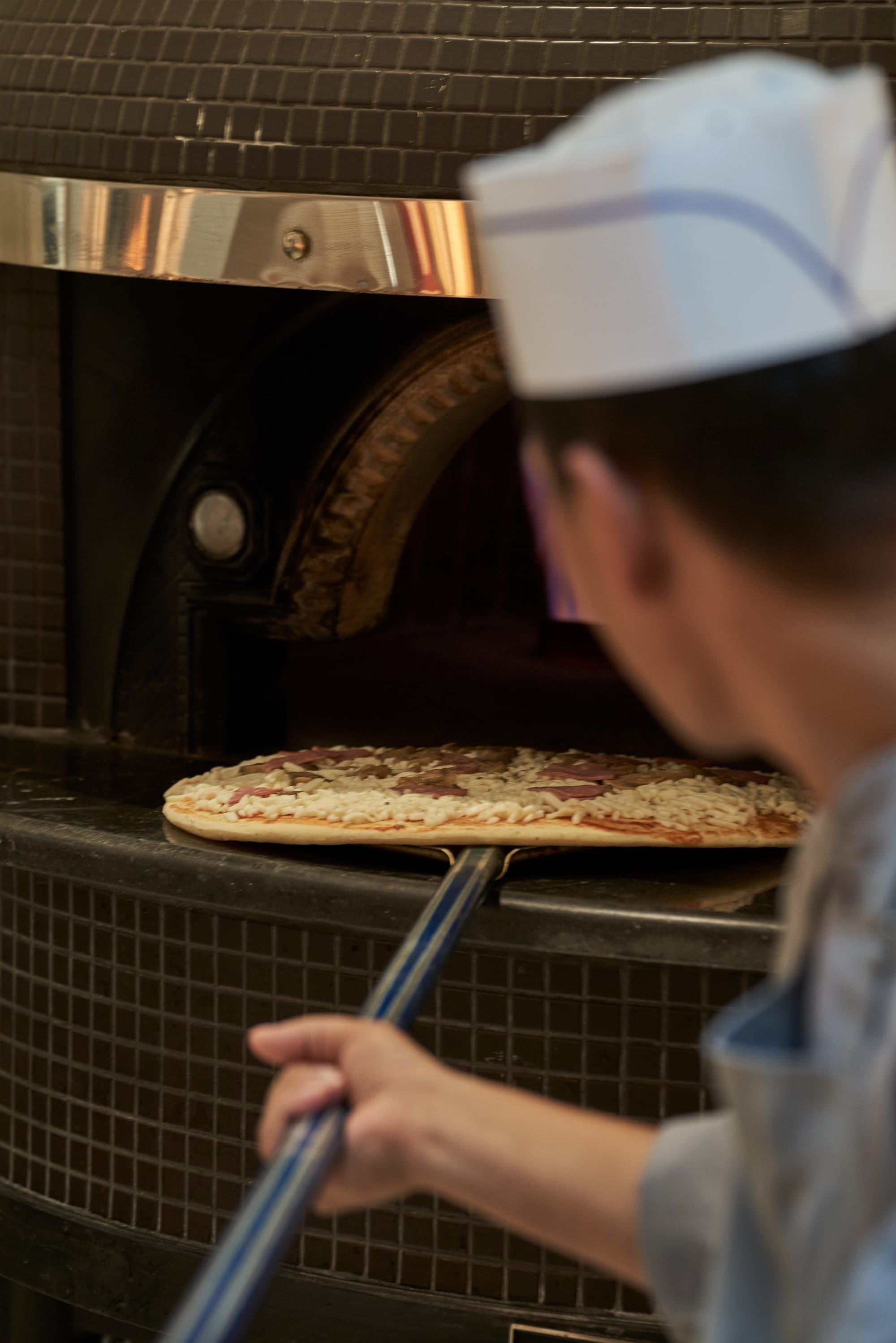 a person is making a pizza