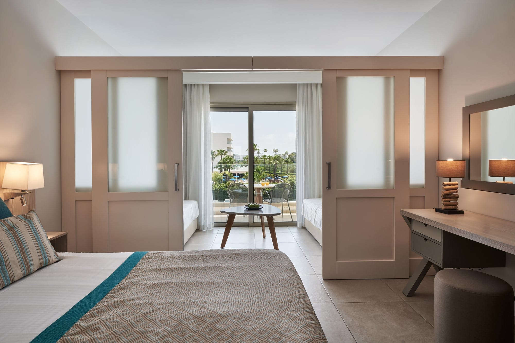 a bedroom with a large window