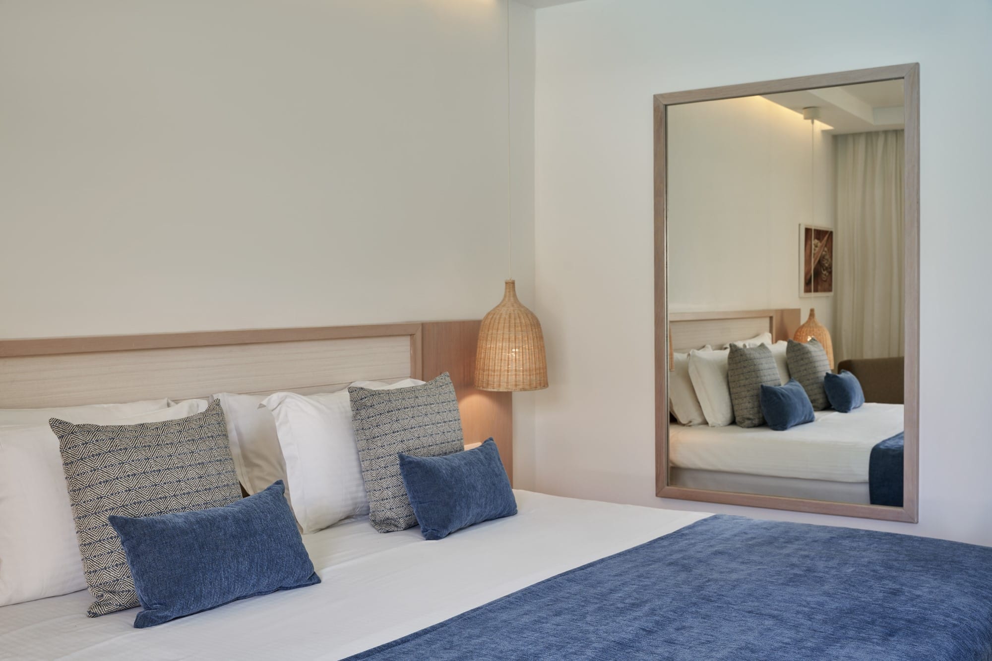 a bed with blue pillows