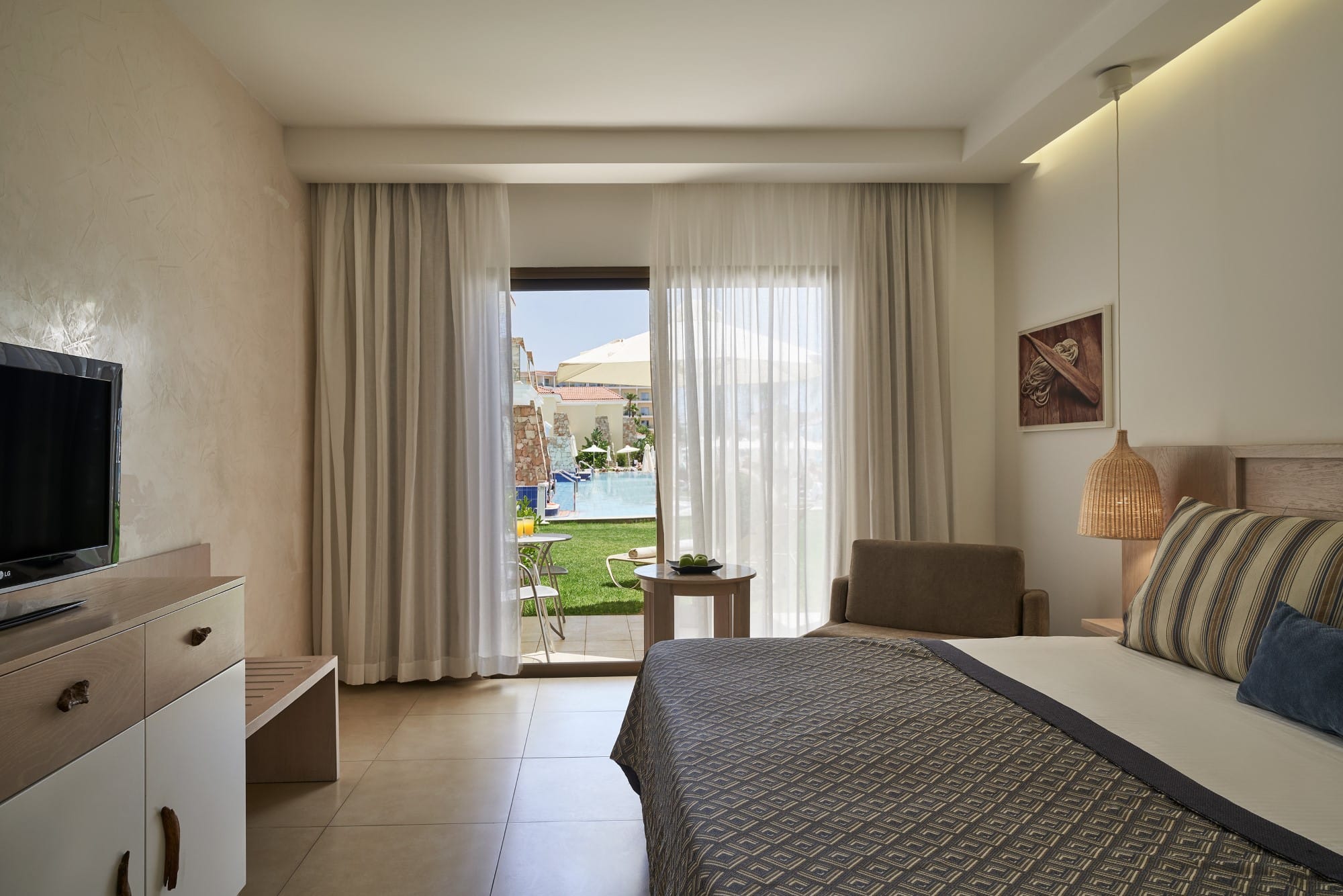 a bedroom with a large window