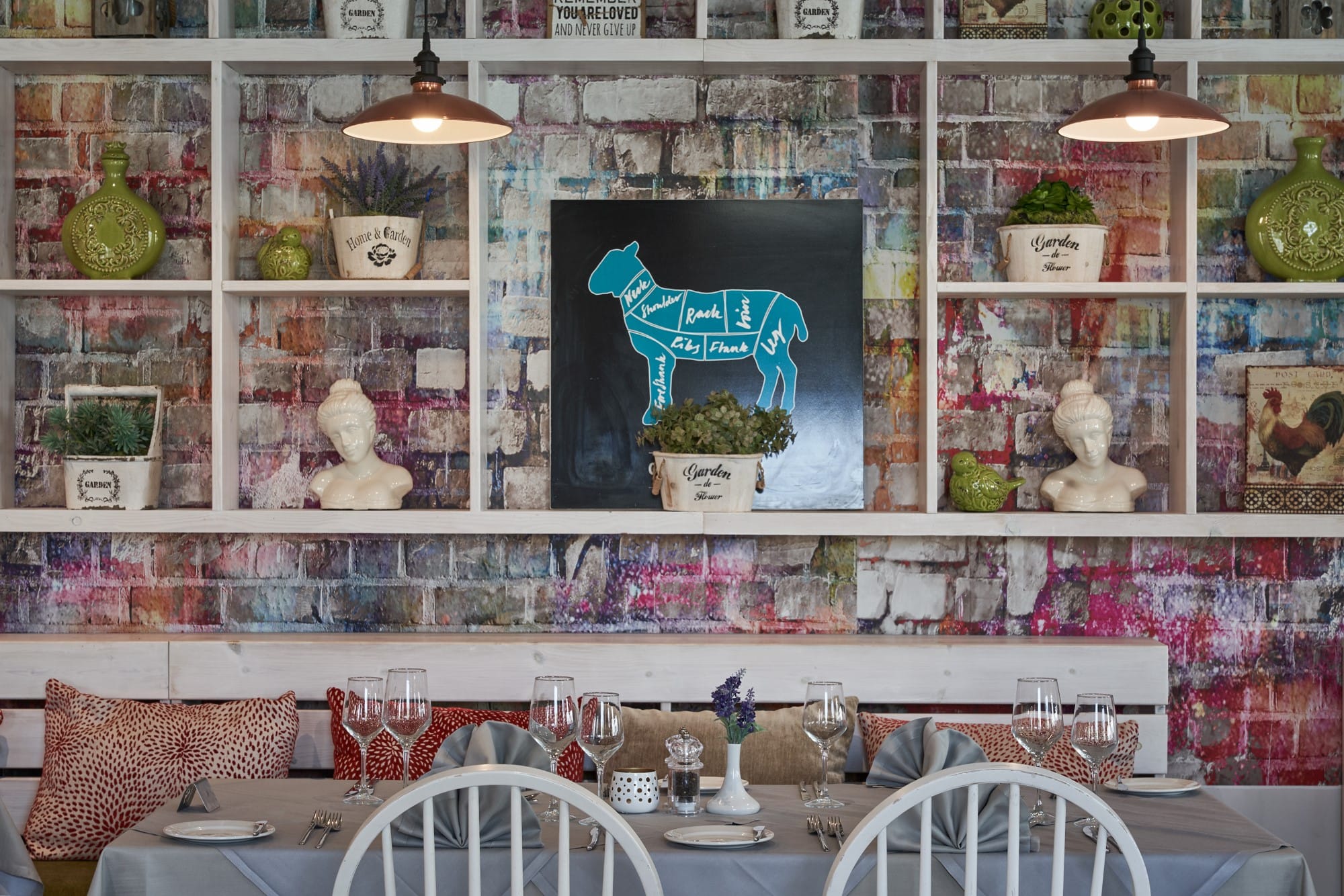 a table with a white shelf with objects on it