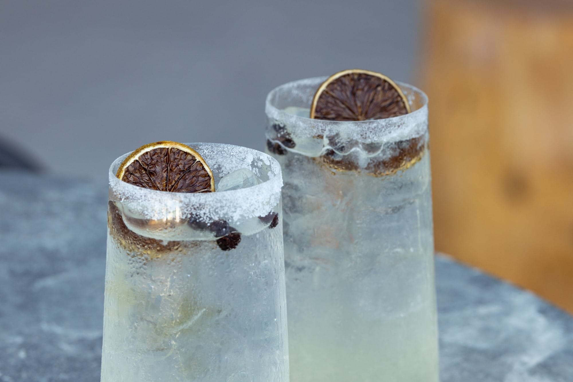 a couple of glass jars with brown liquid in them