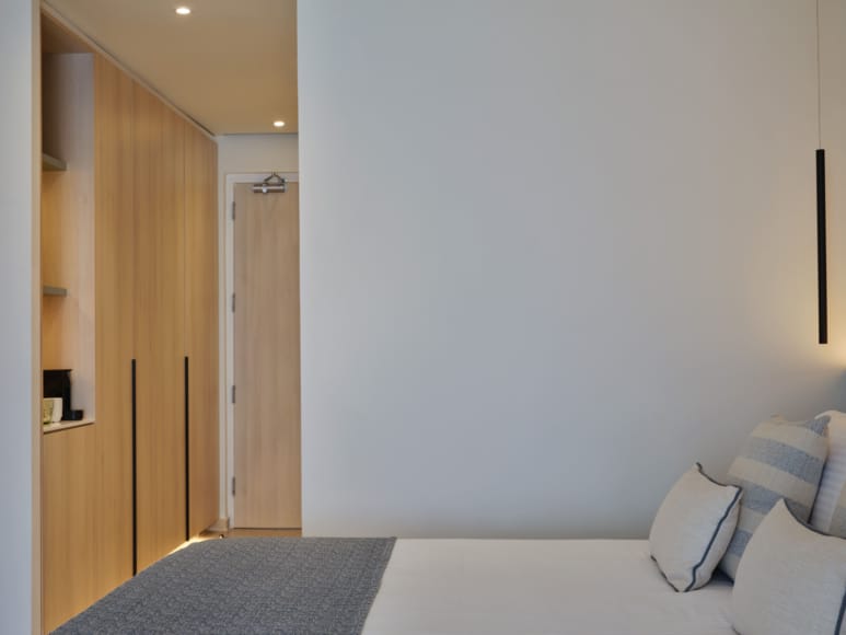 a room with a bed and a door