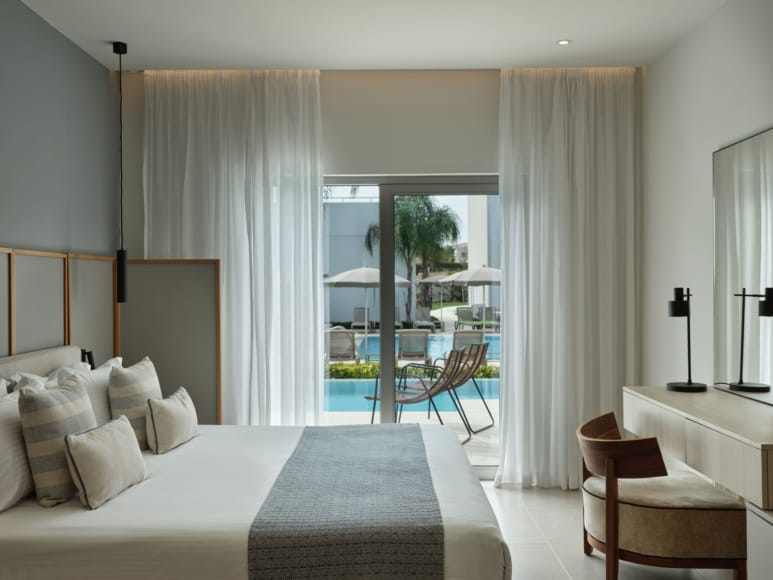 a bedroom with a large glass door