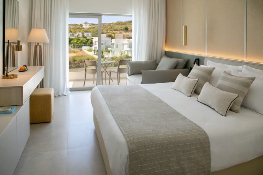a bed with white pillows