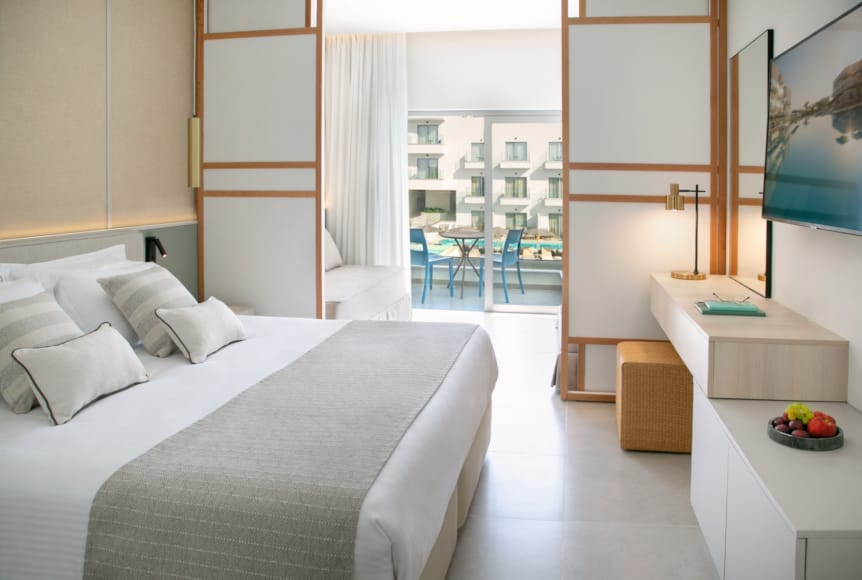 a bedroom with a large window