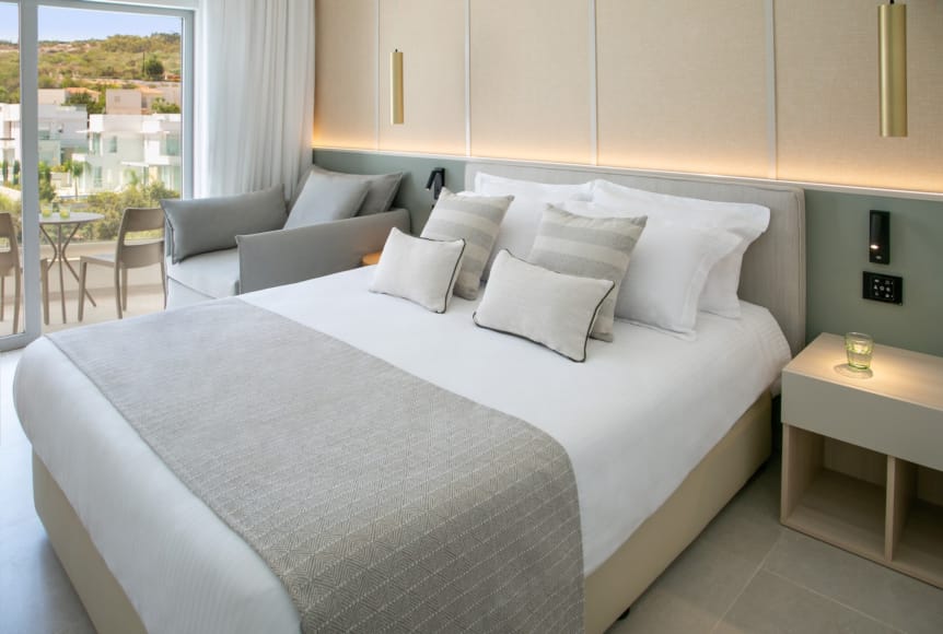 a bed with white pillows