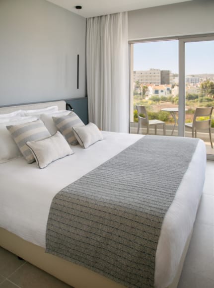 a bed with white sheets