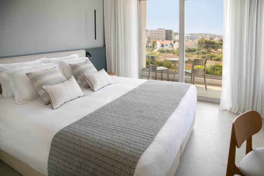 a bed with white sheets