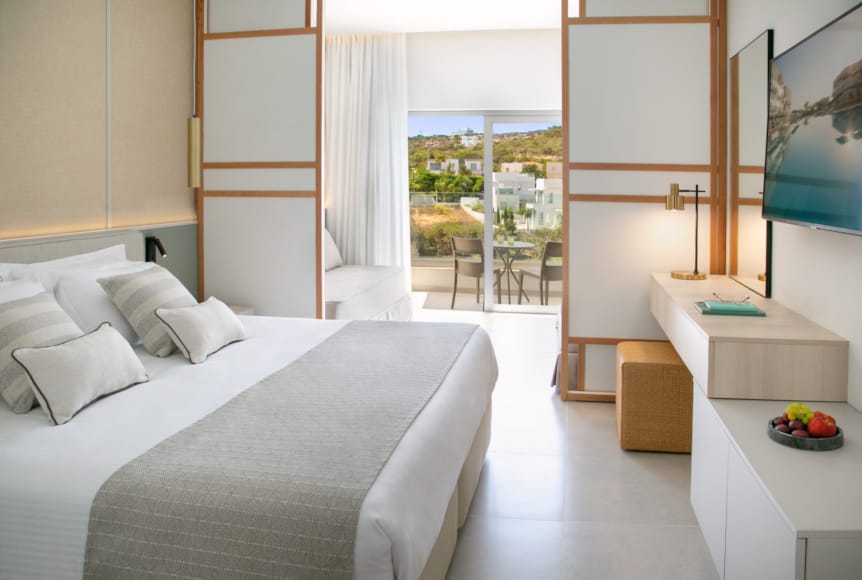 a bedroom with a large window