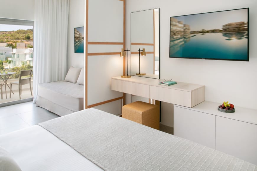 a room with a bed and a chair