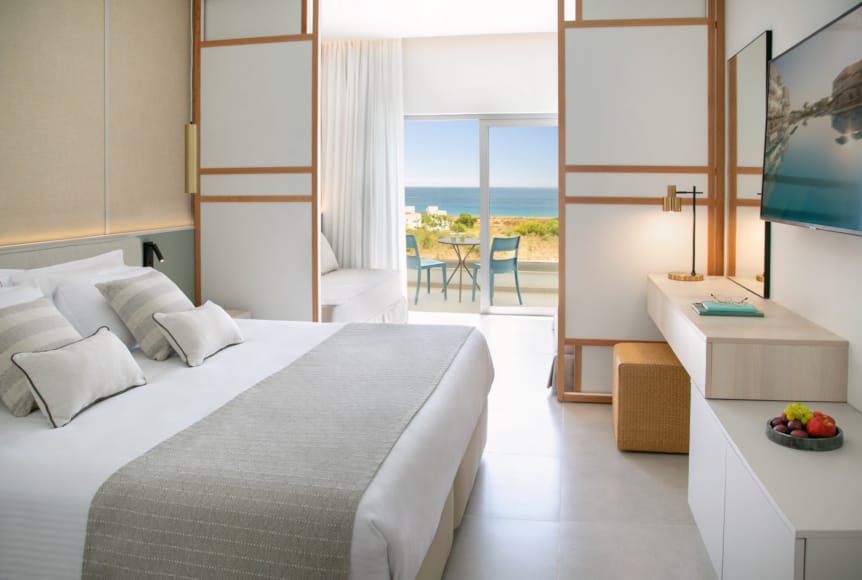 a bedroom with a bed and a table