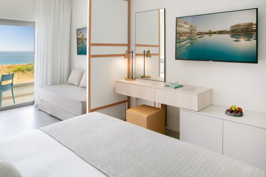a room with a bed and a desk