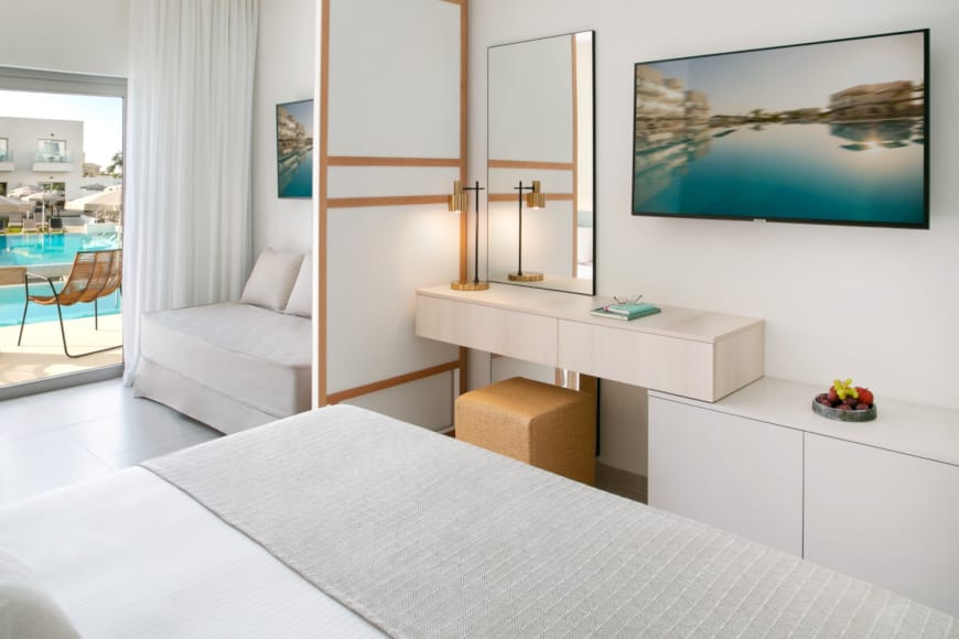 a room with a bed and a chair