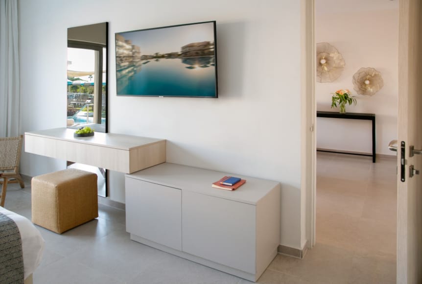 a room with a white couch and a table