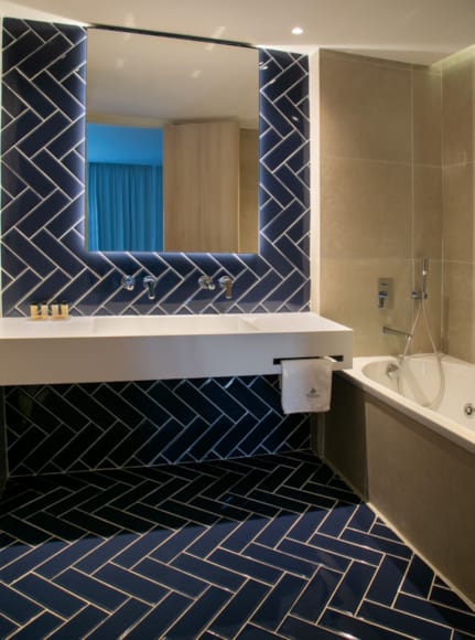 a bathroom with a tub and sink