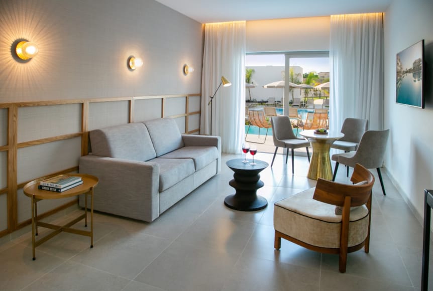 a living room with a couch and chairs